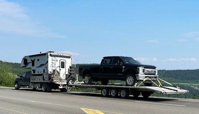 Hauling on the return from Alaska, Rudy Yakym's Ram 5500 loaded with a pickup