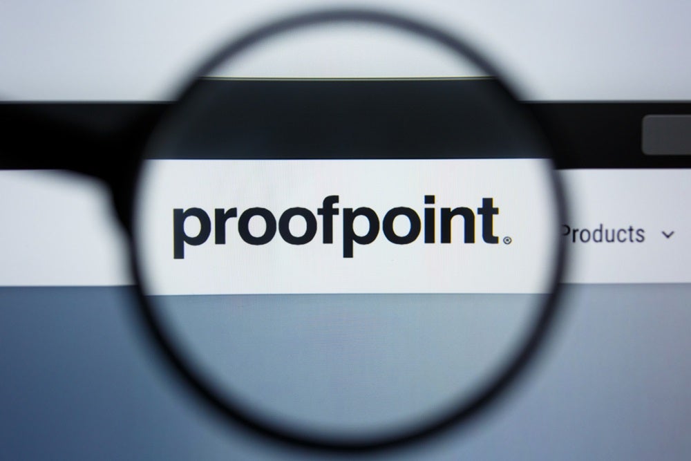 The Proofpoint logo underneath a magnifying glass.