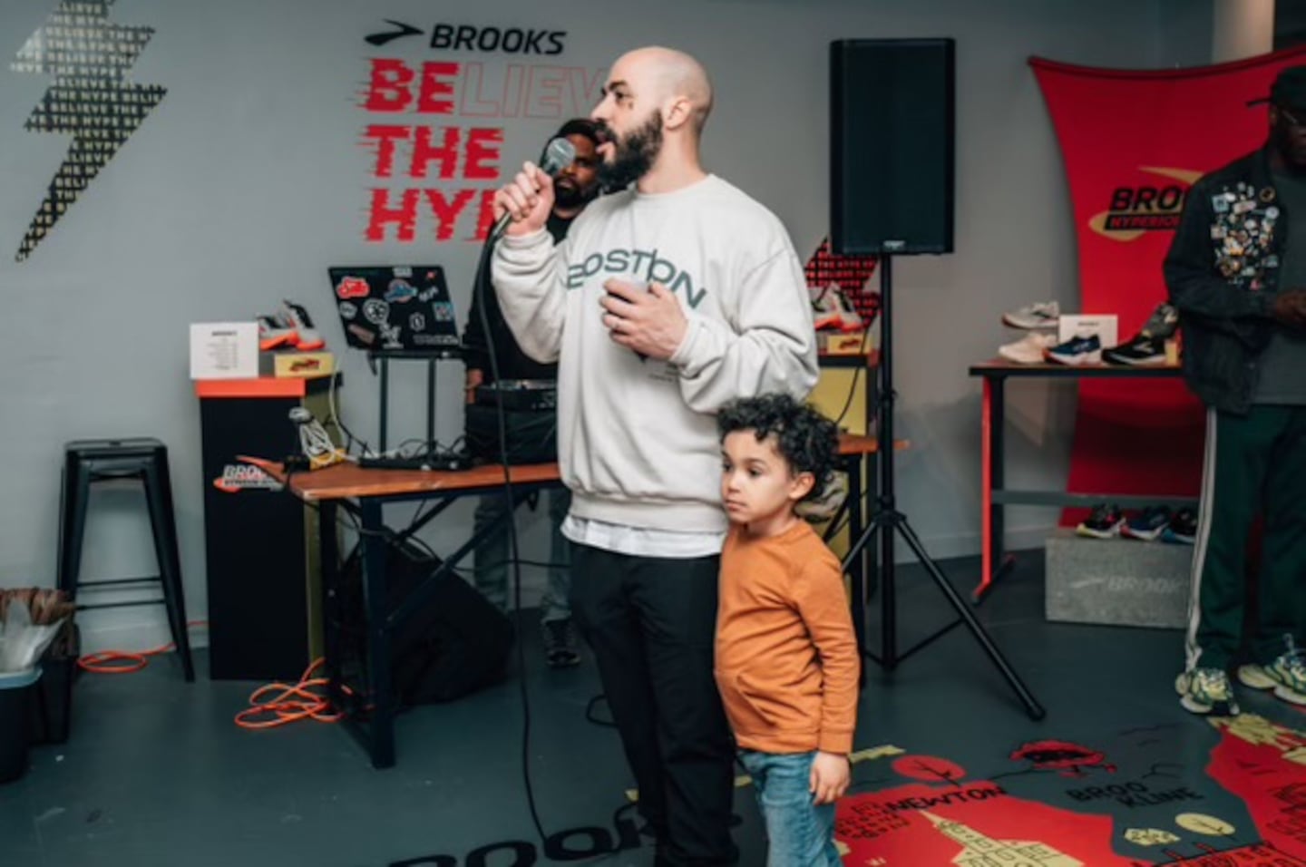 PYNRS founder Sidney Baptista with his son Sebastian at the opening night of a PYNRS pop-up shop on Newbury Street on April 12.