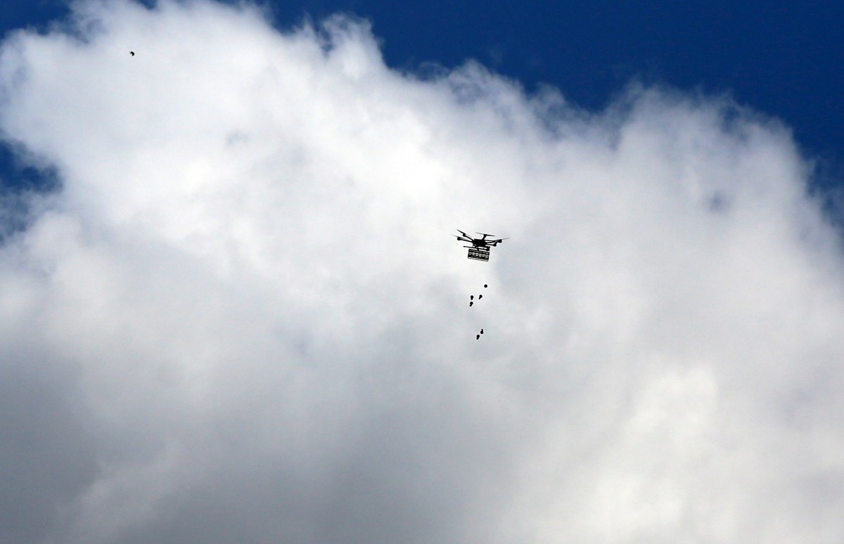 An Israeli drone drops tear gas canisters during clashes following a demonstration near the border with Israel in Malaka east of Gaza City on March 30, 2023, as Palestinians mark Land Day, Land Day marks the killing of six Arab Israelis during 1976 demonstrations against Israeli confiscations of Arab land. (Photo by Majdi Fathi/NurPhoto via AP)