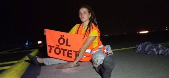 Climate activists stuck to runway hold up cargo flights at Leipzig