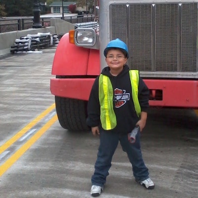 Jordan Foreman as a child in Chicago with Peterbilt