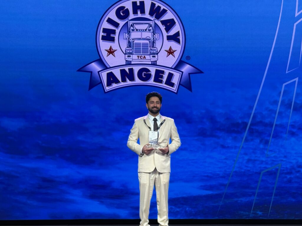 Daljit Sohi on stage with his award